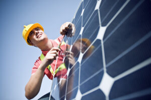 man installing solar panels
